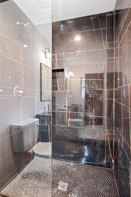 2327 El Paso Road Southwest Atlanta, GA 30331 - Photo 16 of 35 a bathroom with a glass door shower
