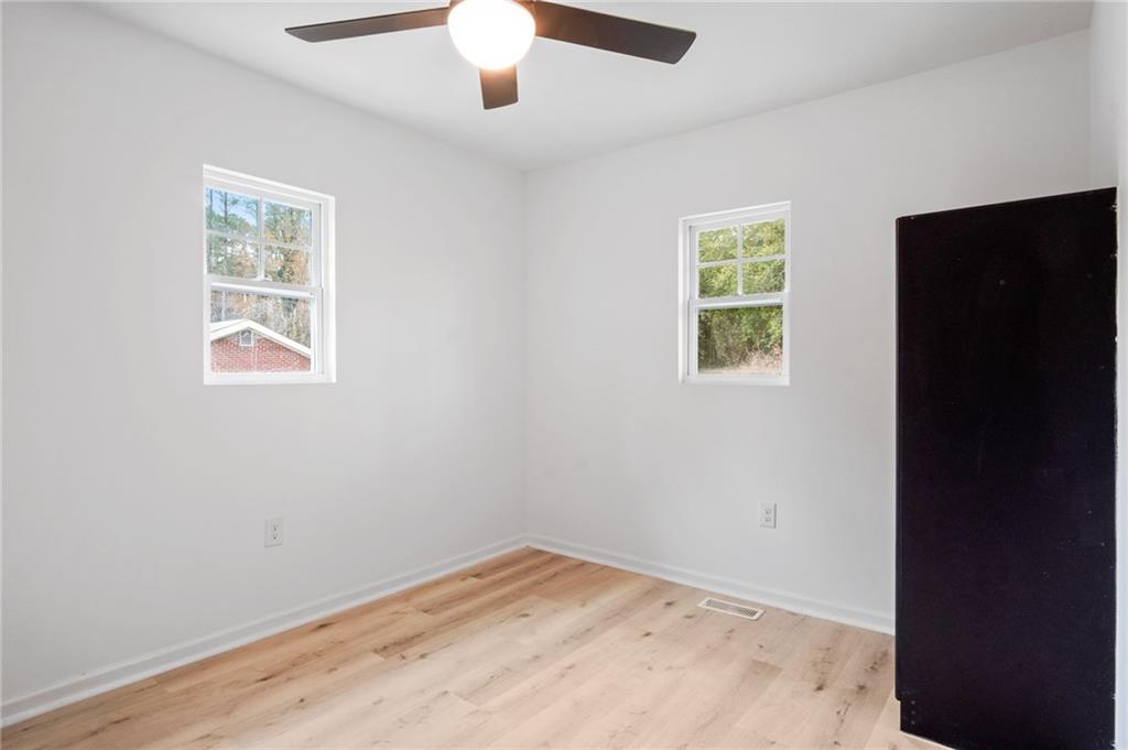 2327 El Paso Road Southwest Atlanta, GA 30331 - Photo 23 of 35 an empty room with a window and a ceiling fan