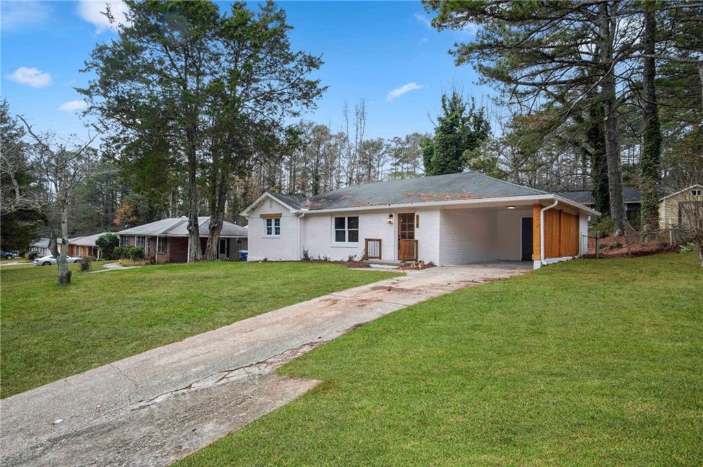 2327 El Paso Road Southwest Atlanta, GA 30331 - Photo 3 of 35 a front view of house with yard and green space