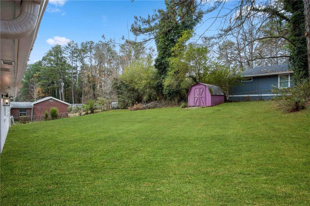 2327 El Paso Road Southwest Atlanta, GA 30331 - Photo 34 of 35 a view of a backyard with a garden and fire pit