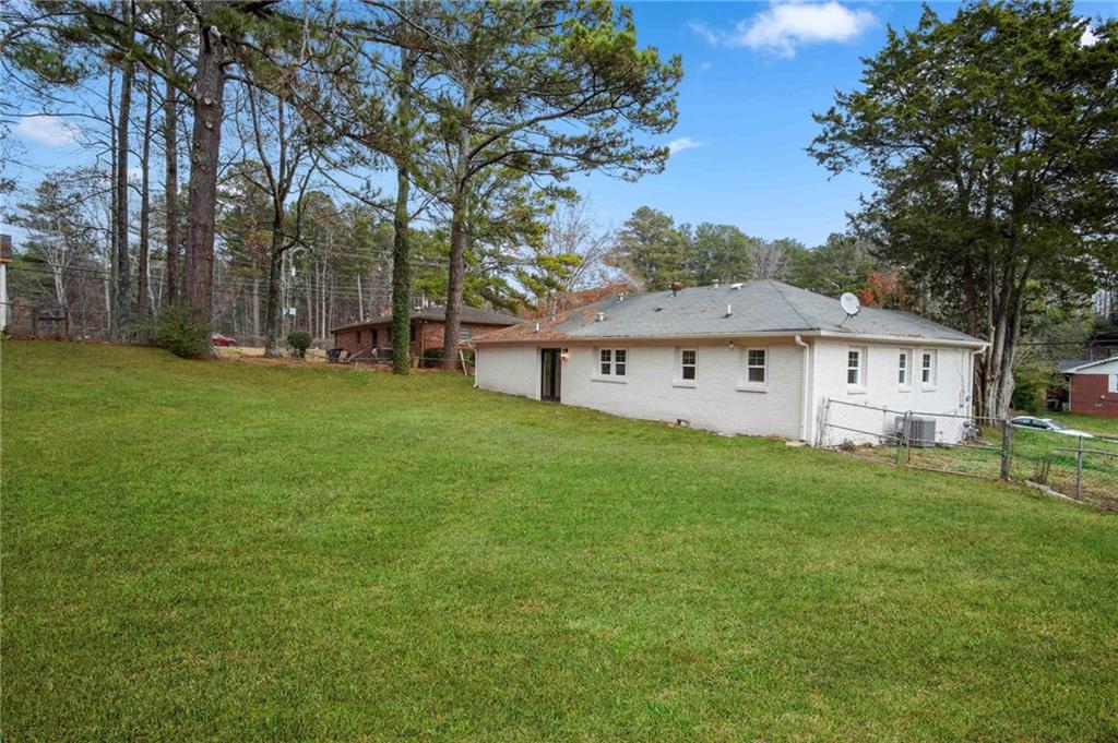 2327 El Paso Road Southwest Atlanta, GA 30331 - Photo 35 of 35 a view of a house with a big yard and large trees