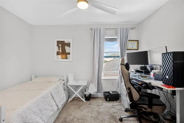 a bedroom with a workspace