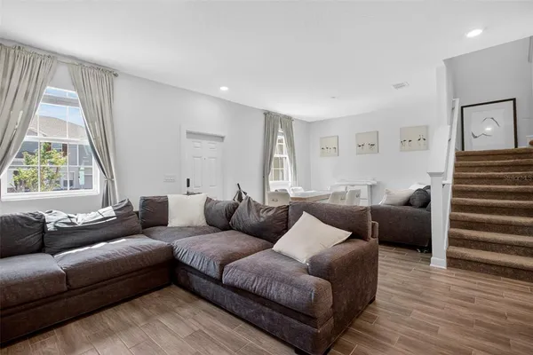 a living room with furniture and a large window