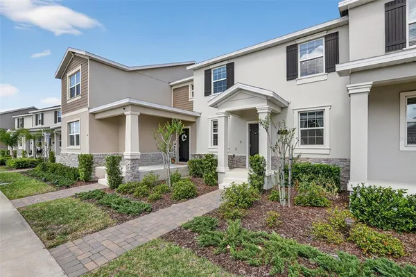 front view of a house with a yard