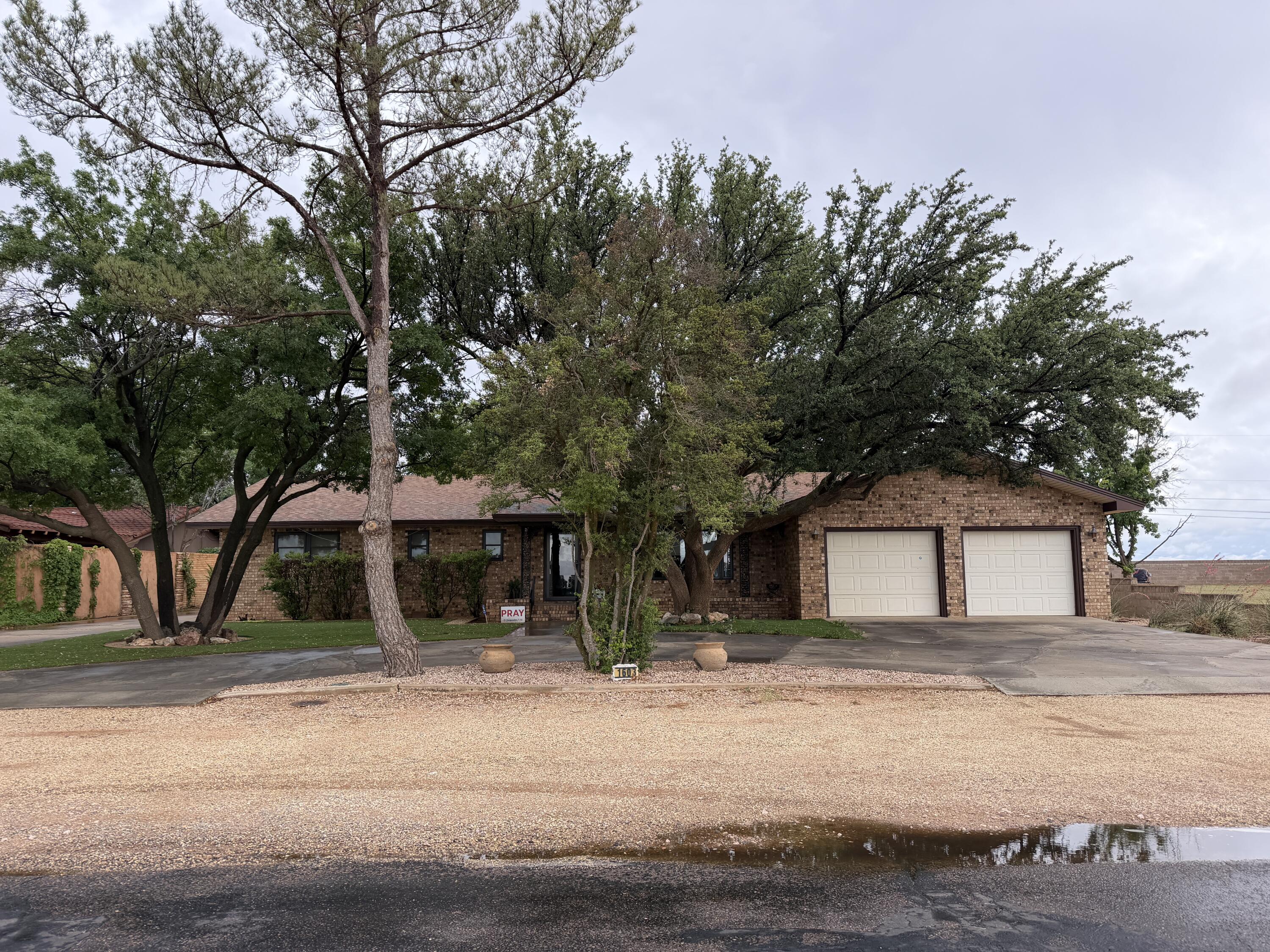 1603 South 8th Street Lamesa, TX 79331 - Photo 1 of 39 a front view of a house with a yard