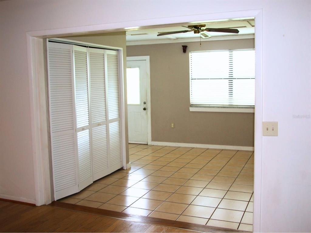 2282 Firestone Place Winter Haven, FL 33884 - Photo 15 of 34 a view of an empty room with wooden floor and a window