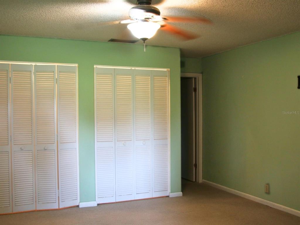 2282 Firestone Place Winter Haven, FL 33884 - Photo 22 of 34 a view of a livingroom with a chandelier fan