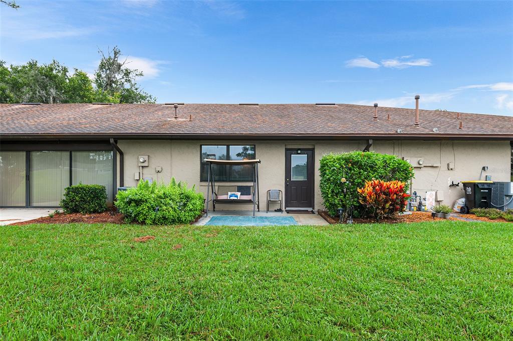 2282 Firestone Place Winter Haven, FL 33884 - Photo 26 of 34 a view of a house with a garden and a garden