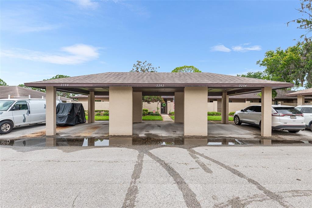 2282 Firestone Place Winter Haven, FL 33884 - Photo 27 of 34 a front view of a house with a garden