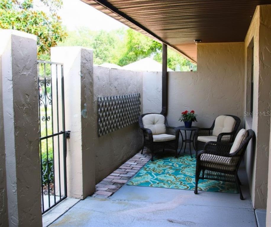 2282 Firestone Place Winter Haven, FL 33884 - Photo 3 of 34 a patio with patio couch and chairs