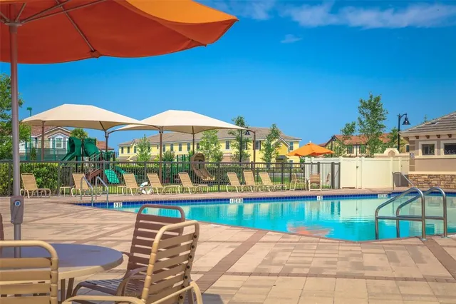 a view of a swimming pool with a lounge chairs