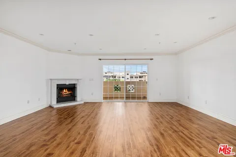 a living room with furniture fireplace and a flat screen tv