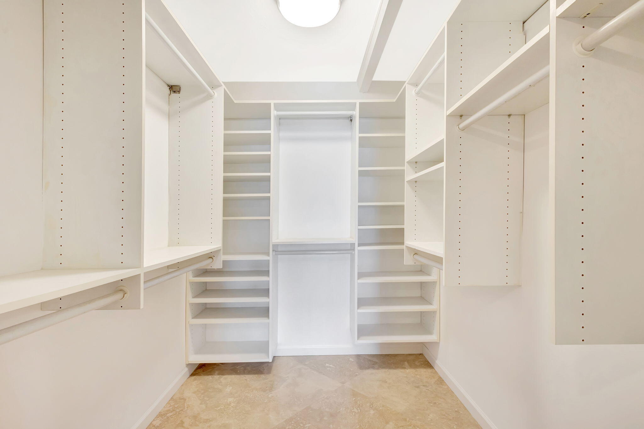 400 South Beach Road, Unit 103 Tequesta, FL 33469 - Photo 21 of 61 a view of walk in closet with empty racks