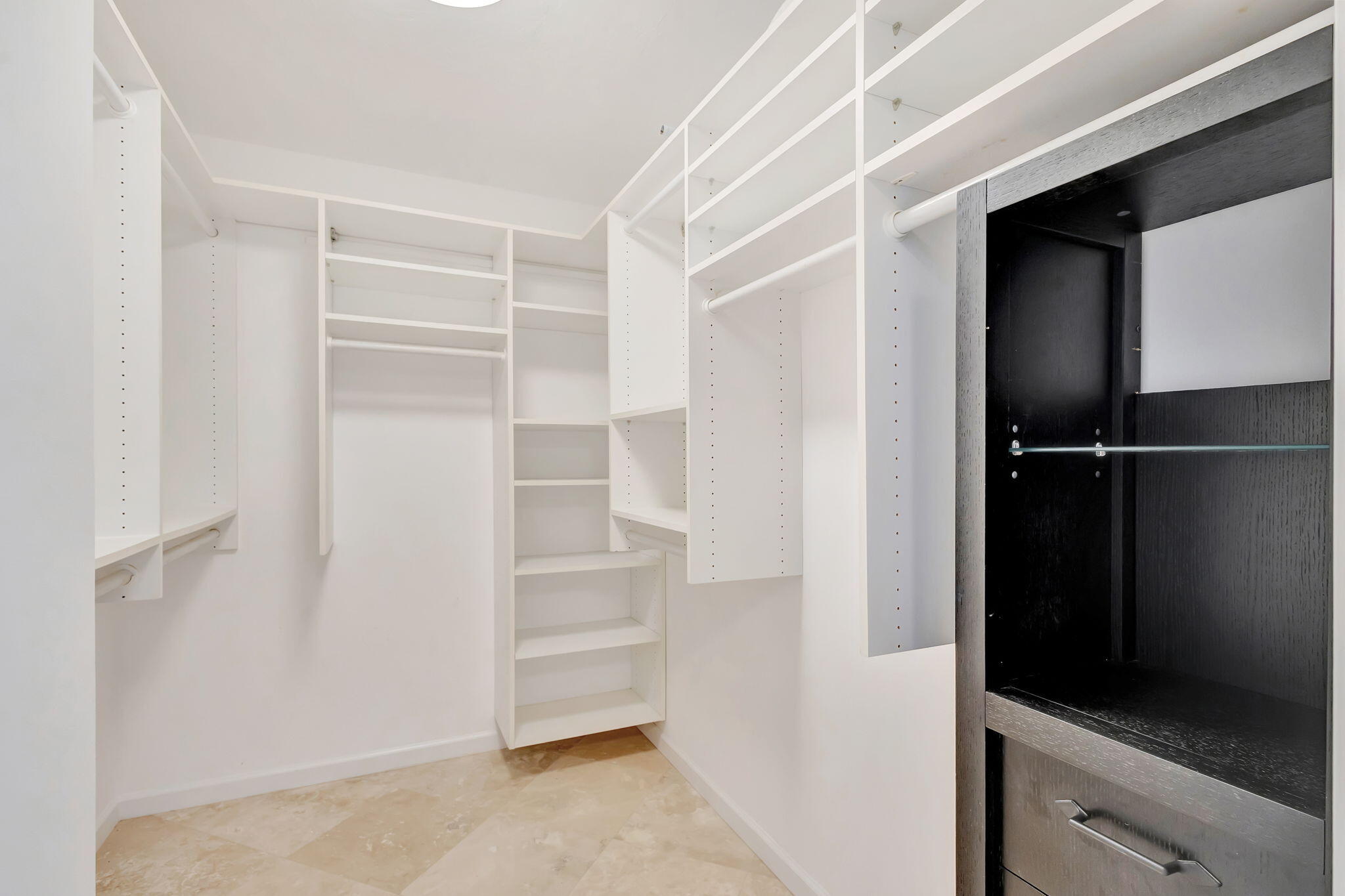 400 South Beach Road, Unit 103 Tequesta, FL 33469 - Photo 26 of 61 a view of walk in closet with empty racks