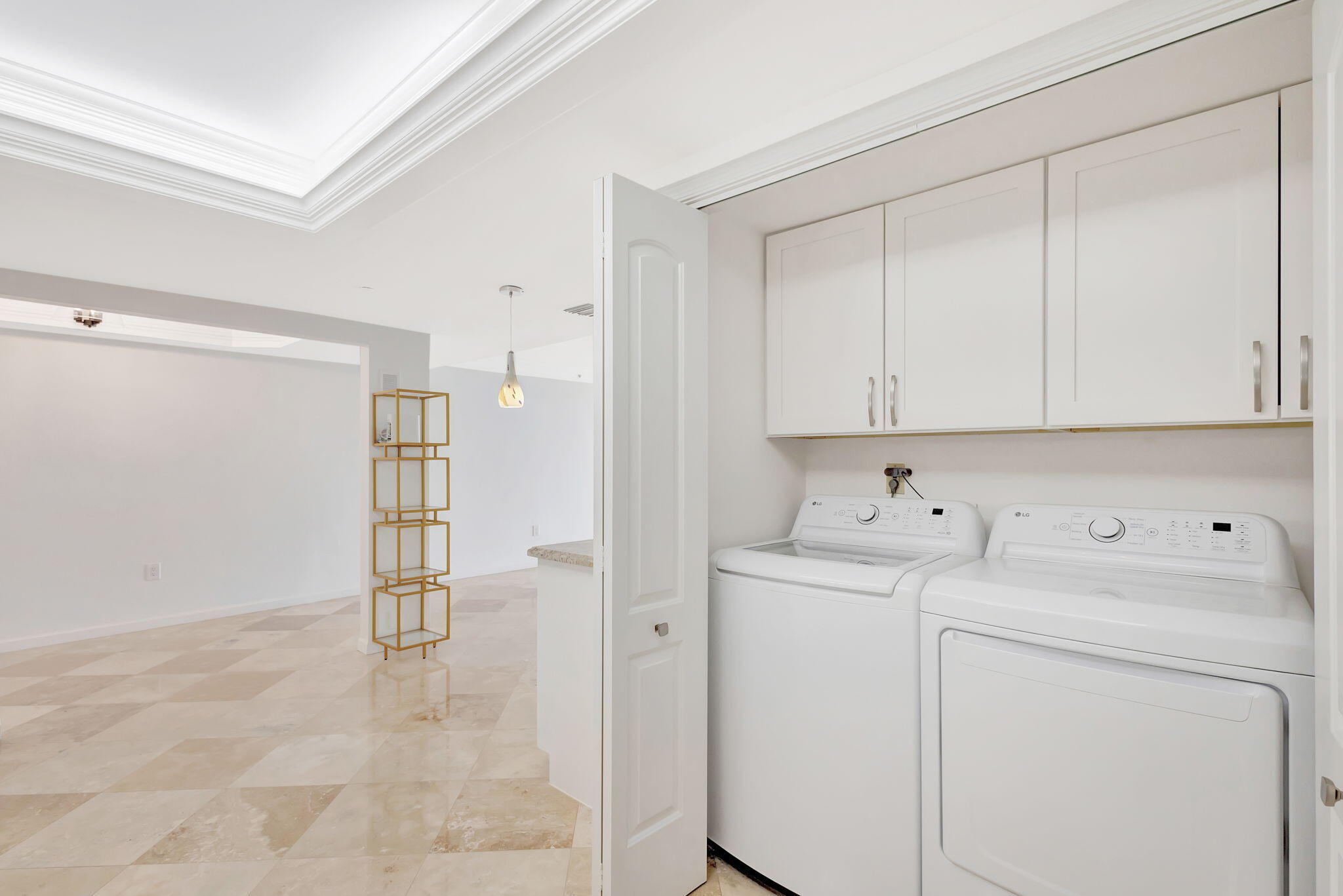 400 South Beach Road, Unit 103 Tequesta, FL 33469 - Photo 28 of 61 a view of storage and utility room with washer and dryer