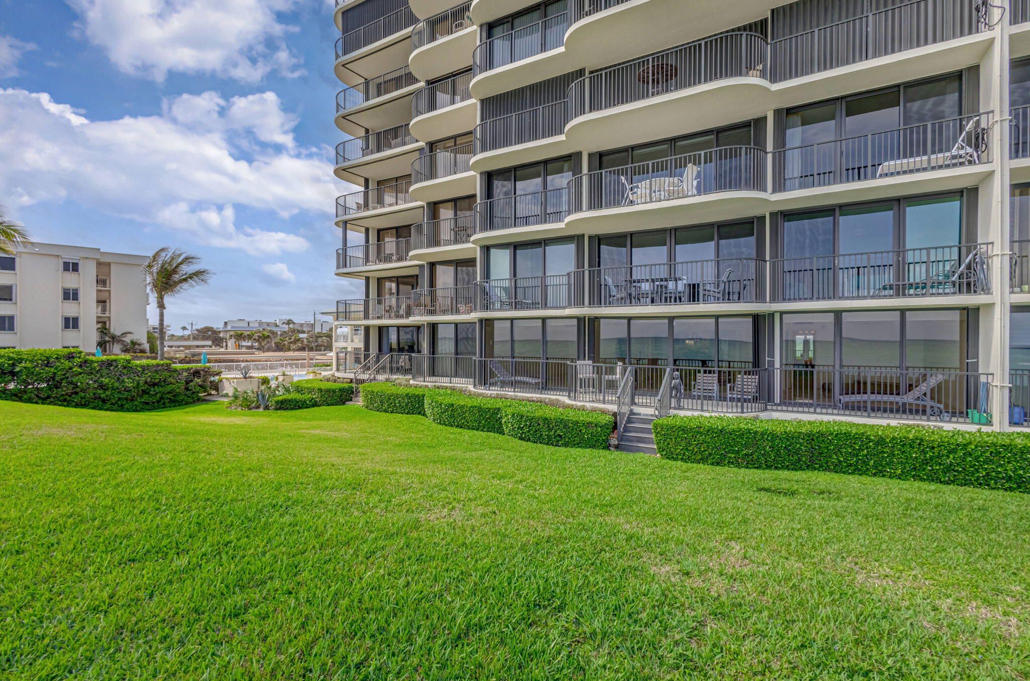 400 South Beach Road, Unit 103 Tequesta, FL 33469 - Photo 34 of 61 a view of building with yard
