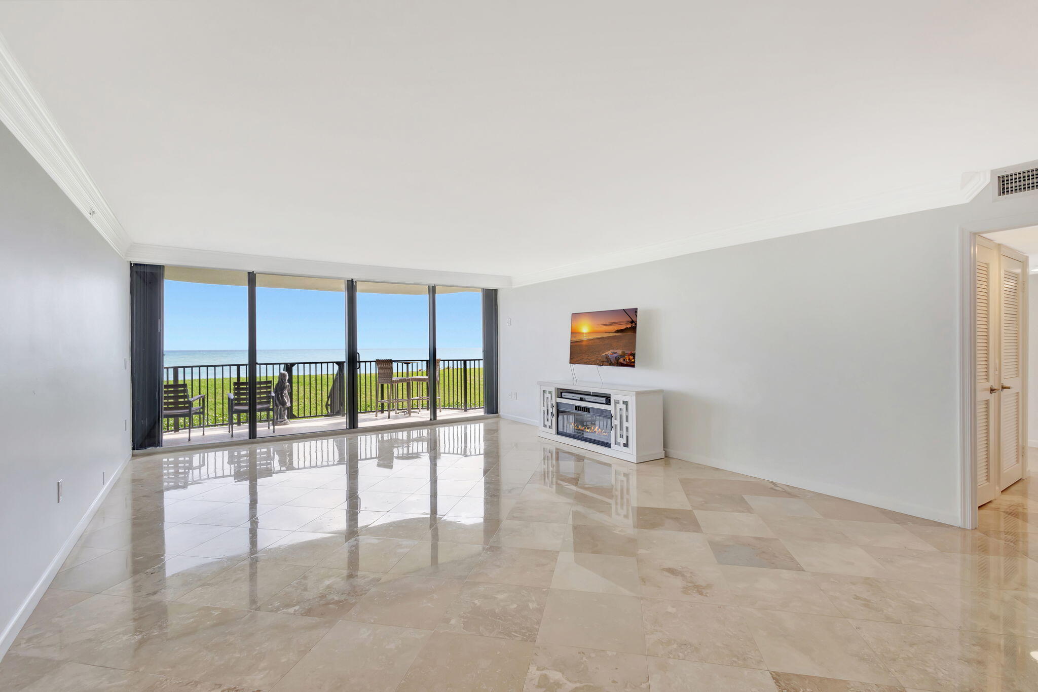 400 South Beach Road, Unit 103 Tequesta, FL 33469 - Photo 4 of 61 a view of a room with floor to ceiling window