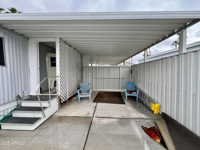 a view of a patio with table and chairs