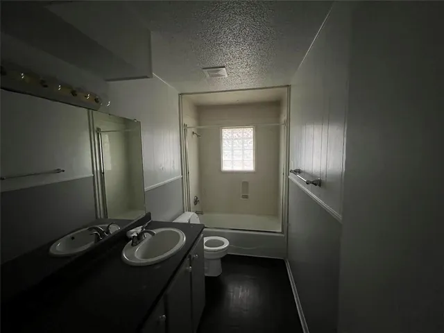 a bathroom with a sink vanity and a mirror