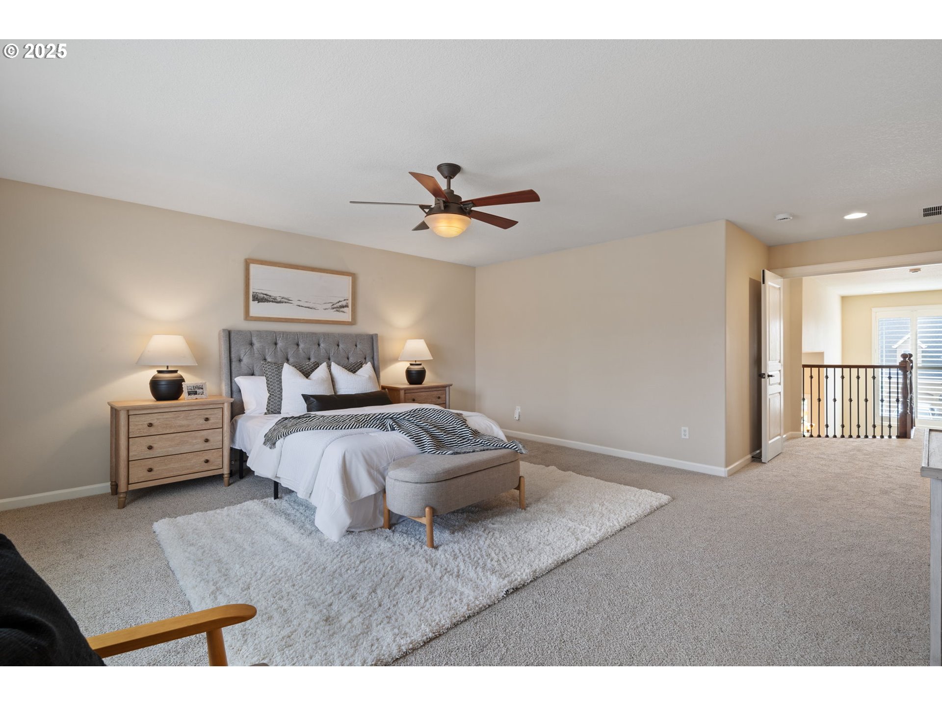1516 South Dusky Drive Ridgefield, WA 98642 - Photo 25 of 43 a spacious bedroom with a bed and a ceiling fan
