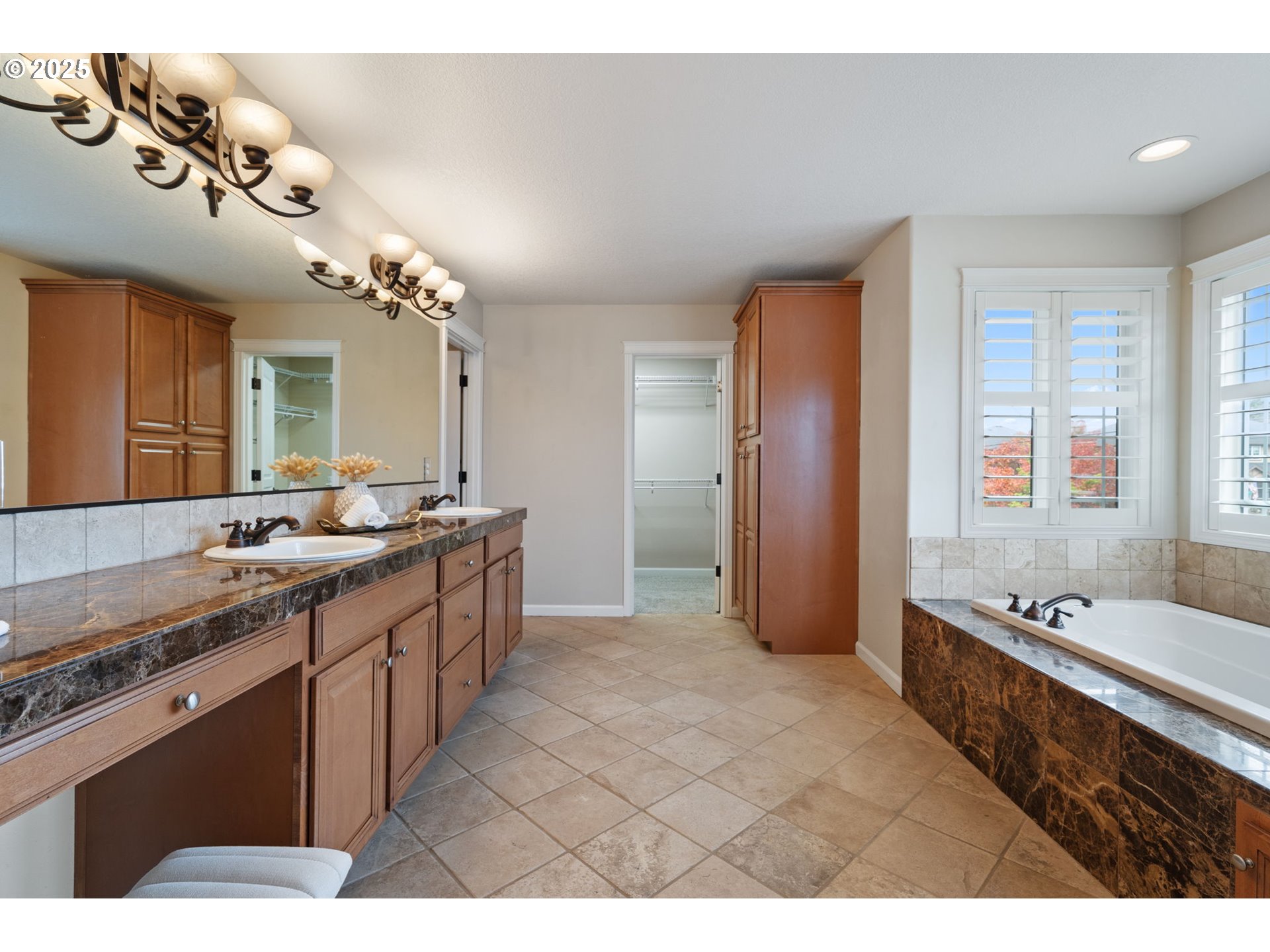 1516 South Dusky Drive Ridgefield, WA 98642 - Photo 26 of 43 a large bathroom with a tub sink and mirror