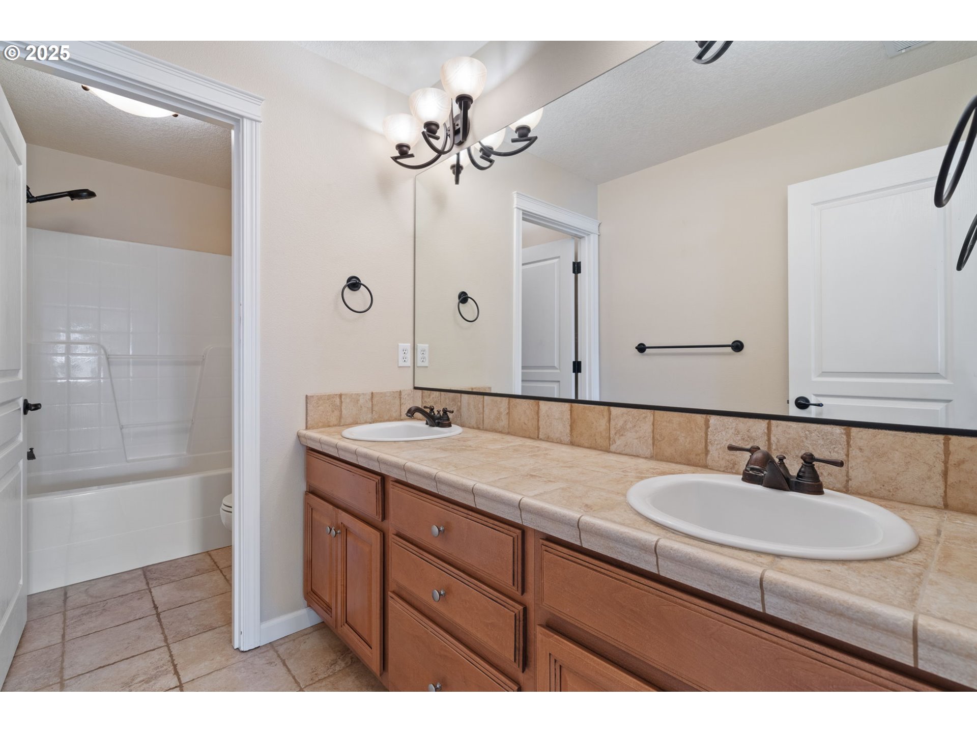 1516 South Dusky Drive Ridgefield, WA 98642 - Photo 35 of 43 a bathroom with a sink double vanity granite tub shower and a mirror