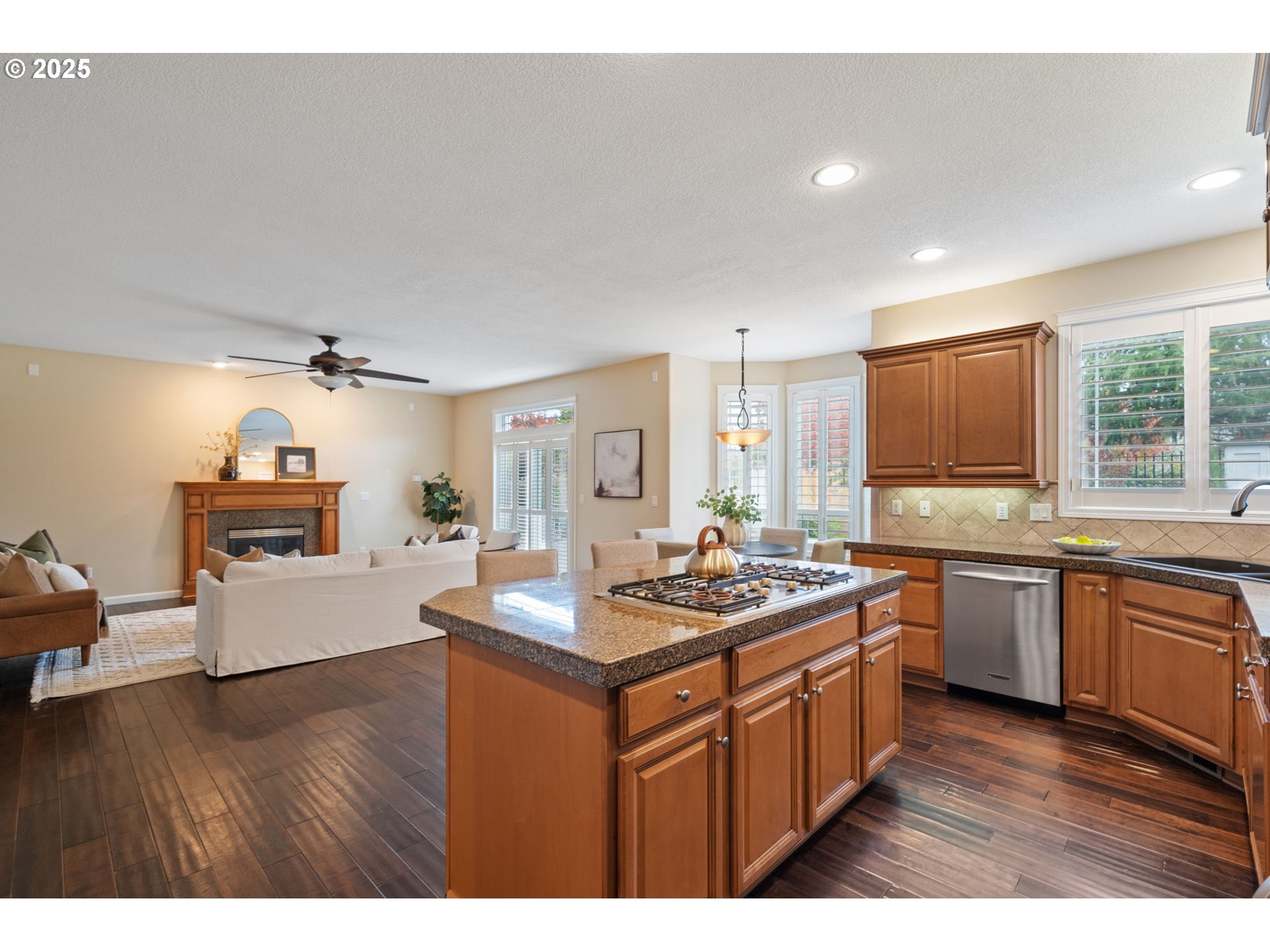 1516 South Dusky Drive Ridgefield, WA 98642 - Photo 8 of 43 a kitchen with stainless steel appliances granite countertop a sink stove and wooden cabinets