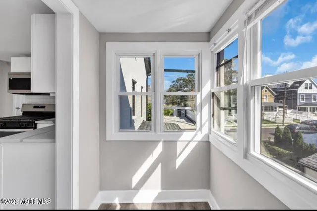a view of a living room with a large window