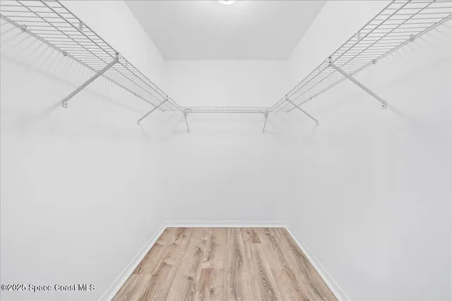 a view of a room with racks on the wall