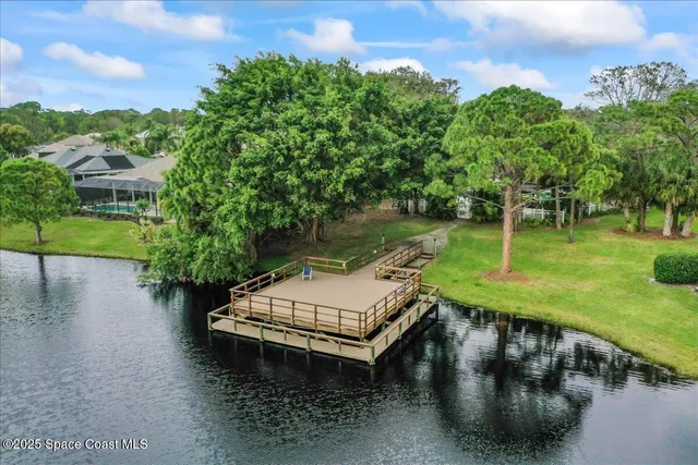 a view of a wooden deck with a yard