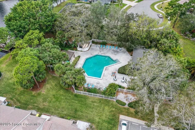 an aerial view of a house with outdoor space