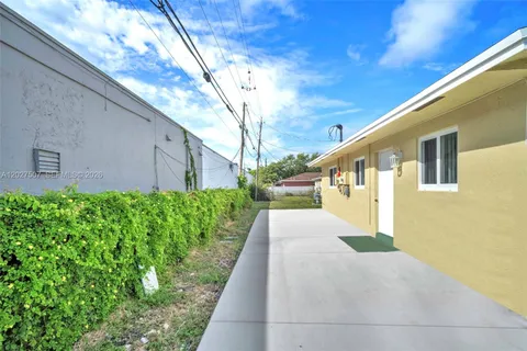 a view of a back yard of the house