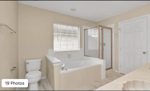 a bathroom with a bathtub and toilet