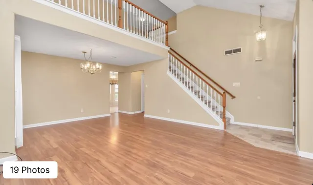 a view of an entryway with wooden floor