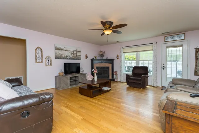 a view of a dining room with furniture and chandelier