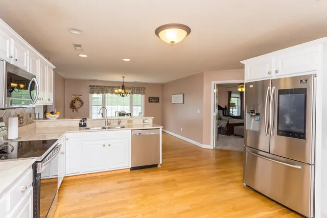 a bathroom with a sink and a window