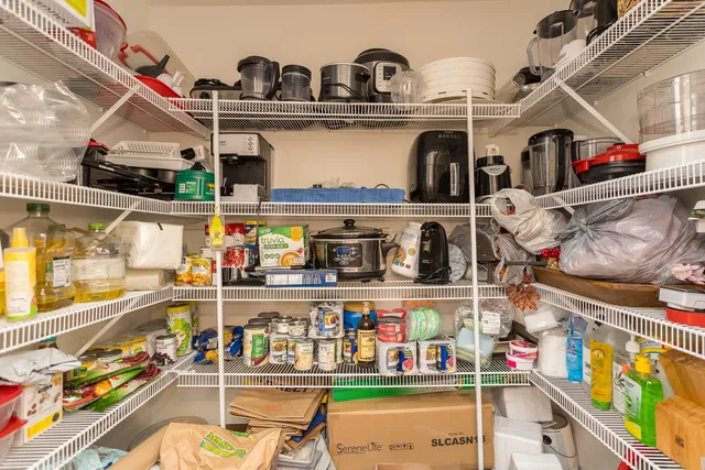 a bathroom with a sink a mirror and a shower