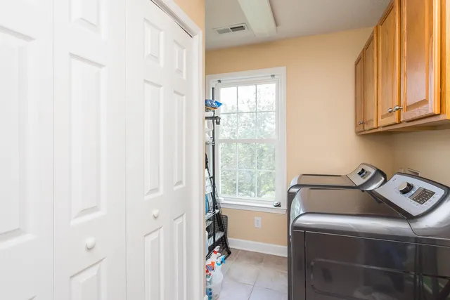 a bathroom with a toilet sink shower and mirror
