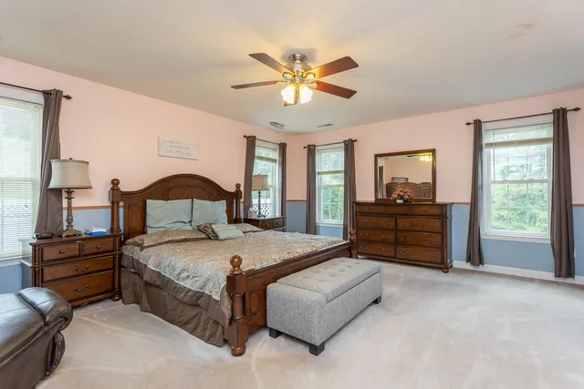 a room with gym equipment and many windows