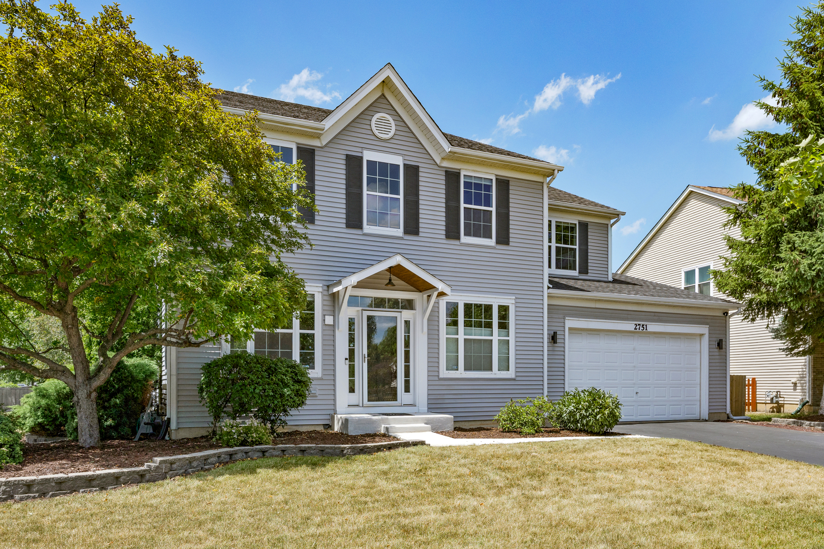 2751 Cedar Creek Cutoff Road Wauconda, IL 60084 - Photo 2 of 34 a front view of a house with yard and trees