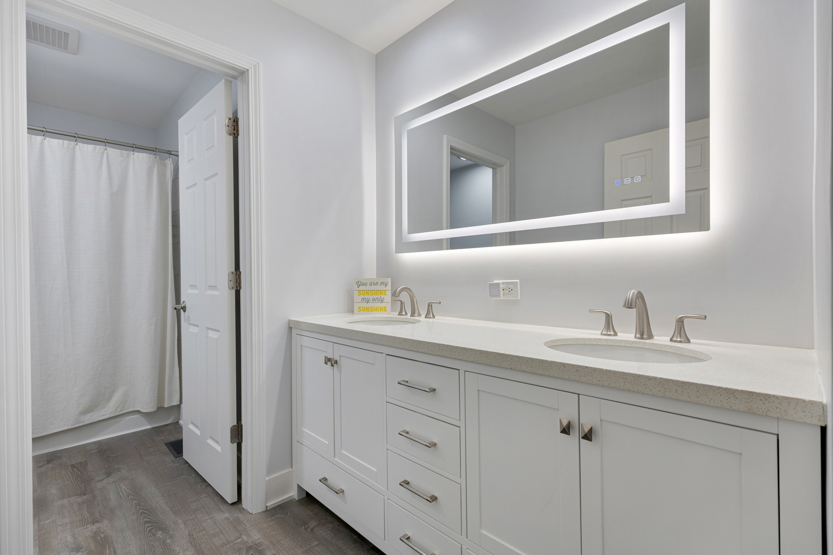 2751 Cedar Creek Cutoff Road Wauconda, IL 60084 - Photo 26 of 34 a bathroom with a double vanity sink and mirror