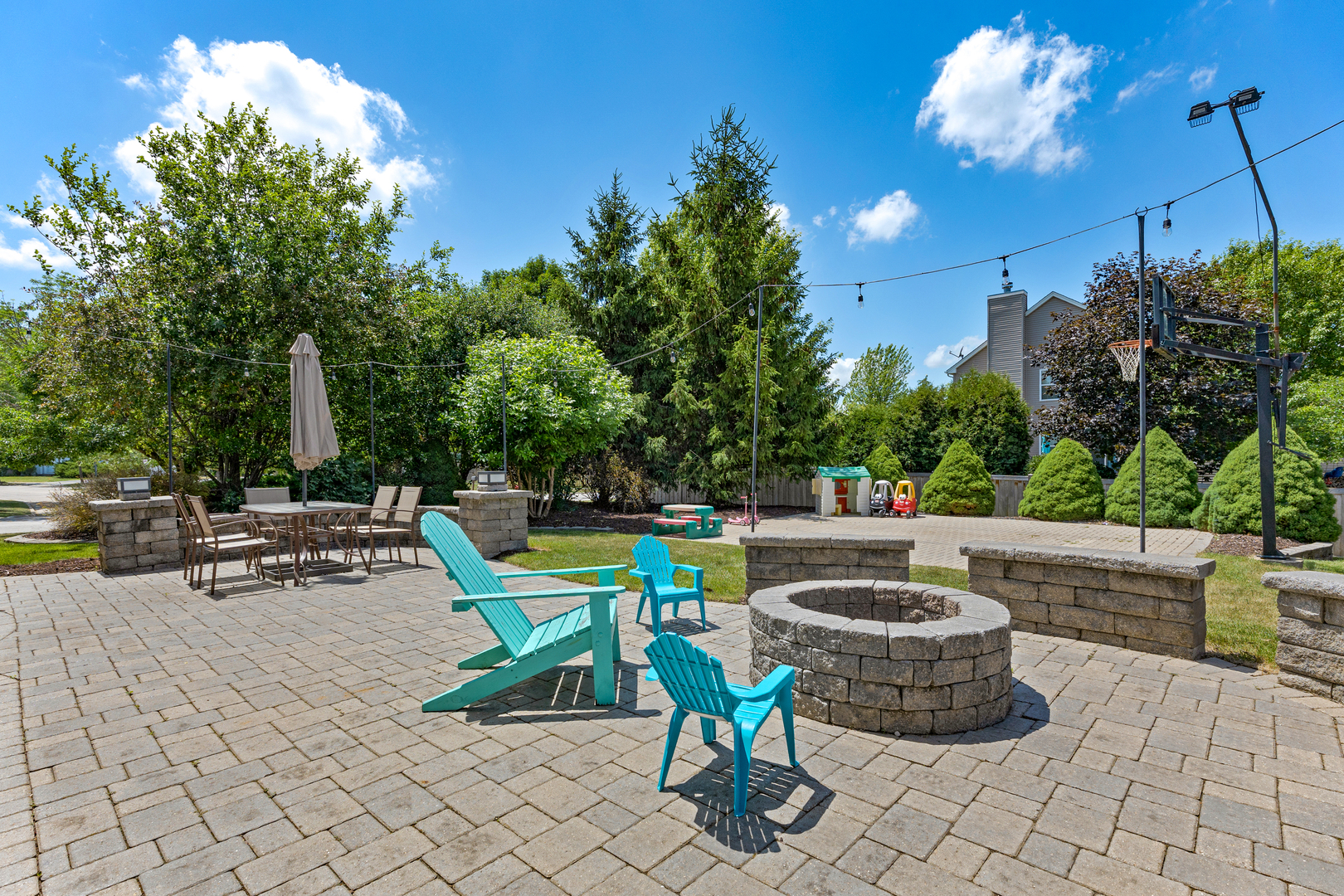 2751 Cedar Creek Cutoff Road Wauconda, IL 60084 - Photo 30 of 34 a view of a patio with table and chairs potted plants with wooden fence