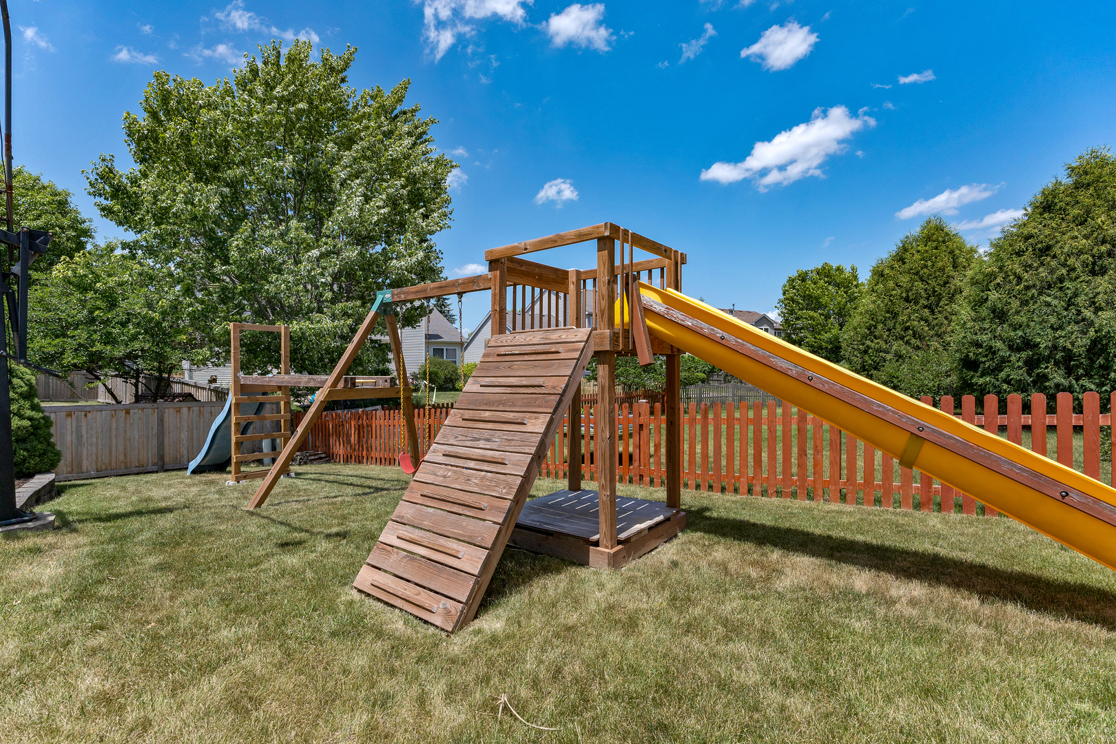 2751 Cedar Creek Cutoff Road Wauconda, IL 60084 - Photo 34 of 34 a view of a roof deck with wooden fence and a bench