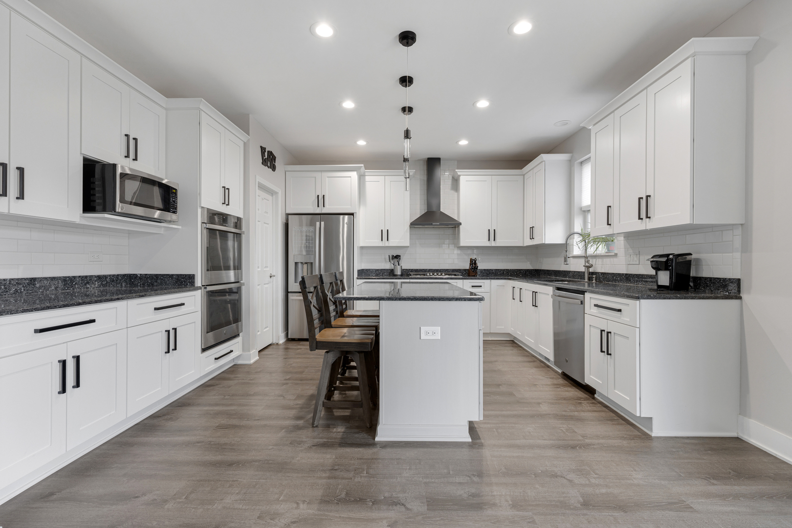 2751 Cedar Creek Cutoff Road Wauconda, IL 60084 - Photo 10 of 34 a kitchen with white cabinets and stainless steel appliances