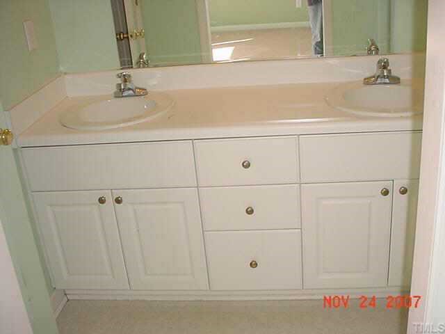 7101 Missionary Ridge Drive Raleigh, NC 27610 - Photo 4 of 4 a bathroom with a sink and vanity