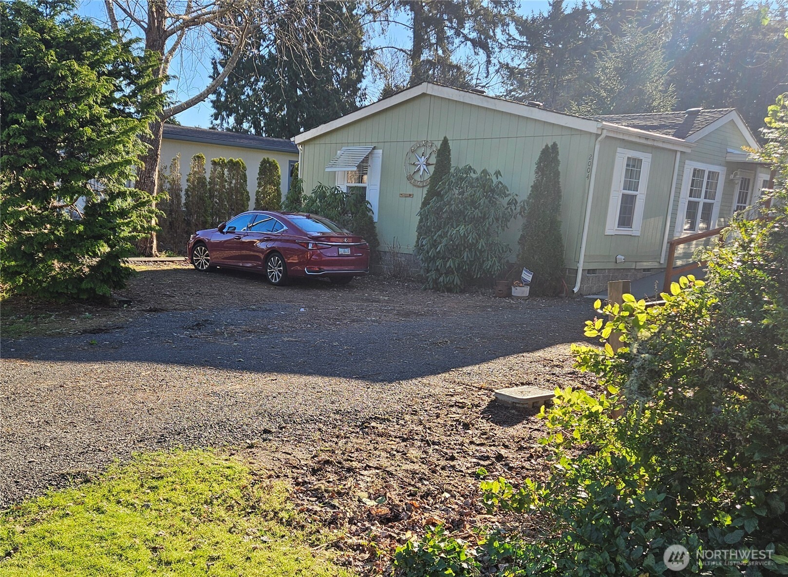 2004 195th Street Long Beach, WA 98631 - Photo 1 of 34 a front view of a house with garden