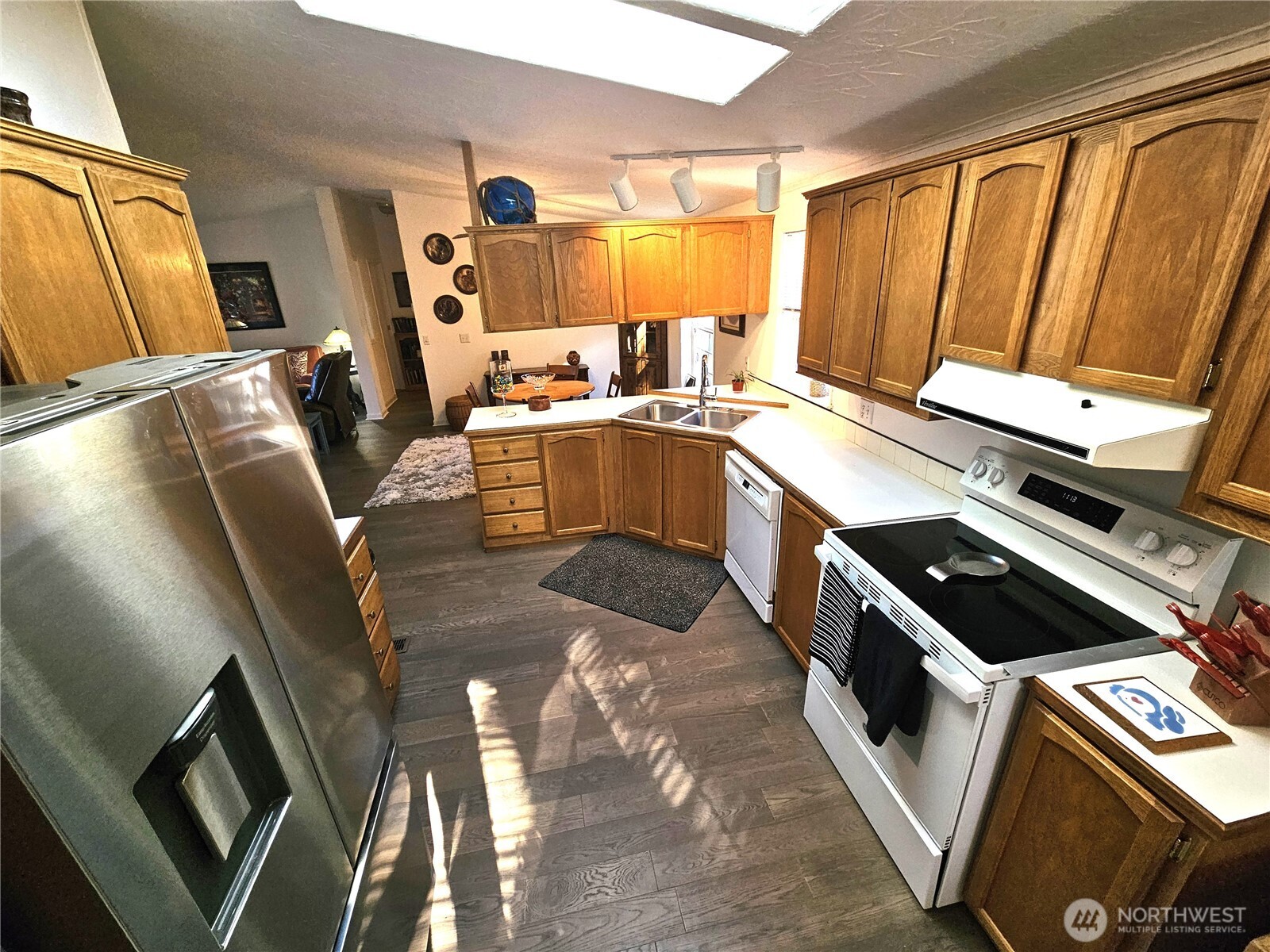 2004 195th Street Long Beach, WA 98631 - Photo 13 of 34 a kitchen with a sink appliances and cabinets