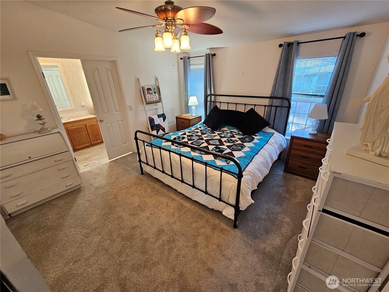 2004 195th Street Long Beach, WA 98631 - Photo 17 of 34 a bedroom with a bed and a mirror on the dresser