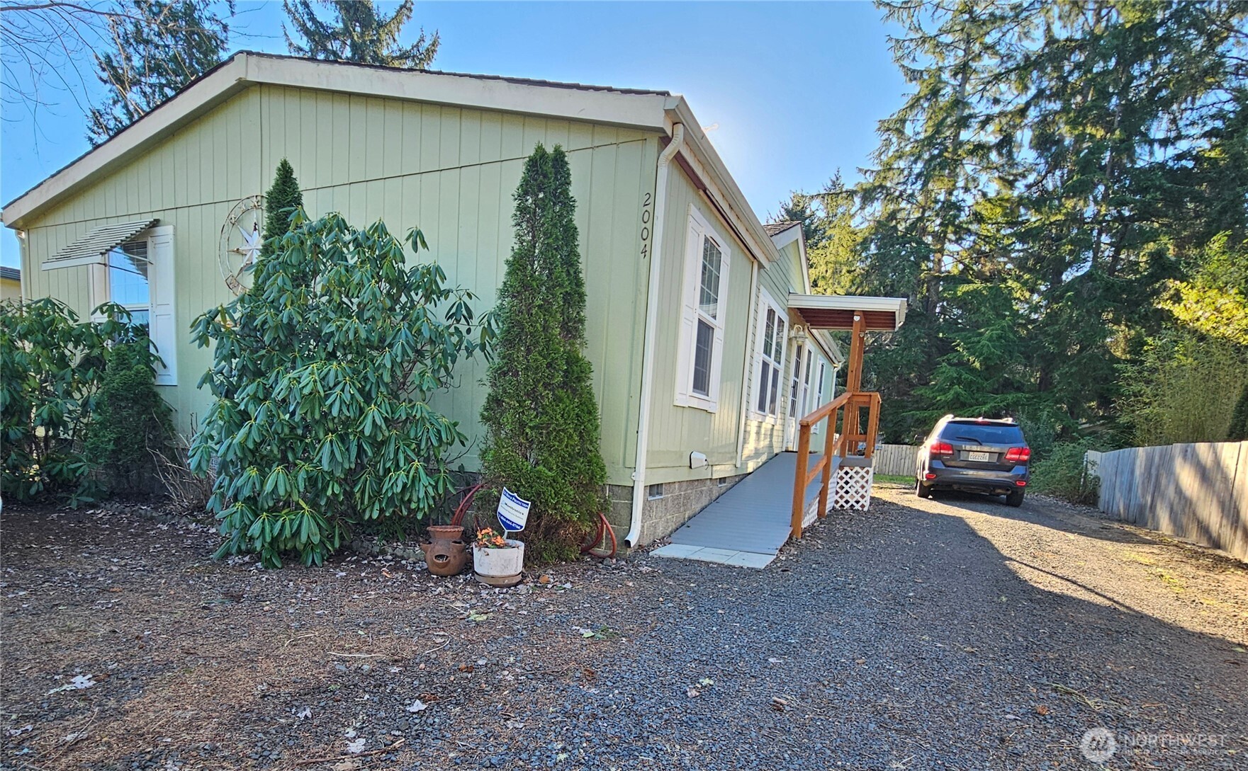 2004 195th Street Long Beach, WA 98631 - Photo 2 of 34 a view of a house with a patio and a yard