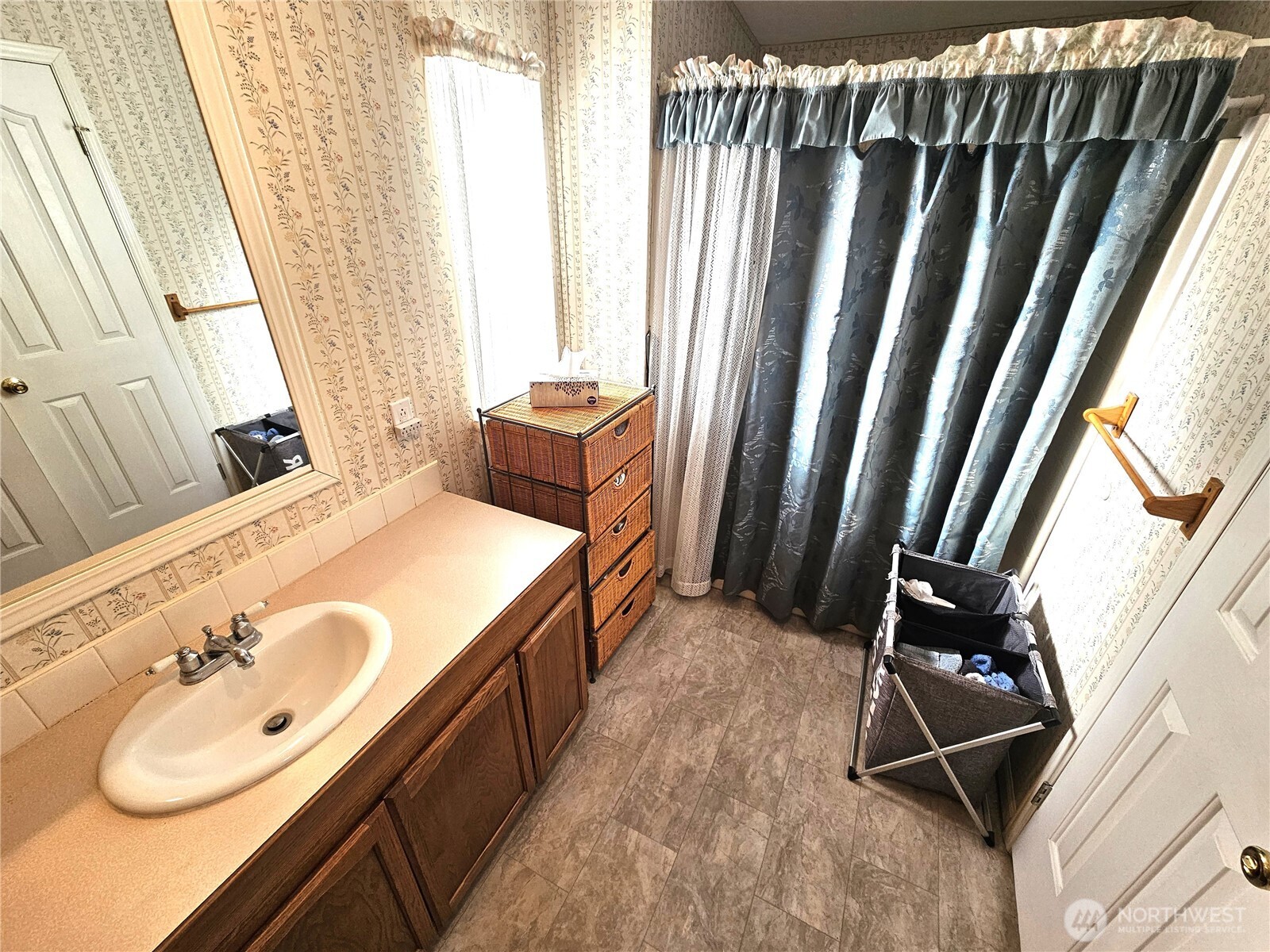 2004 195th Street Long Beach, WA 98631 - Photo 21 of 34 a bathroom with a tub sink and mirror